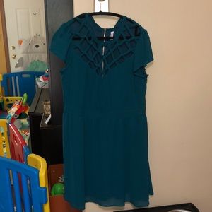 Teal cocktail dress with cage neckline